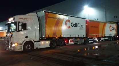 Road train loading by night